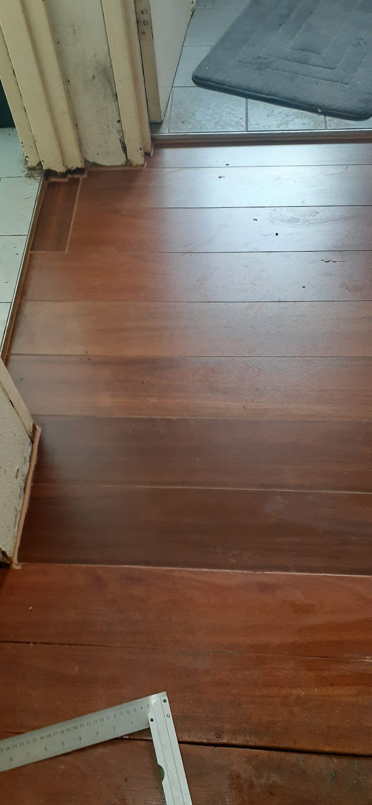 Timber floorboards at a doorway during repair